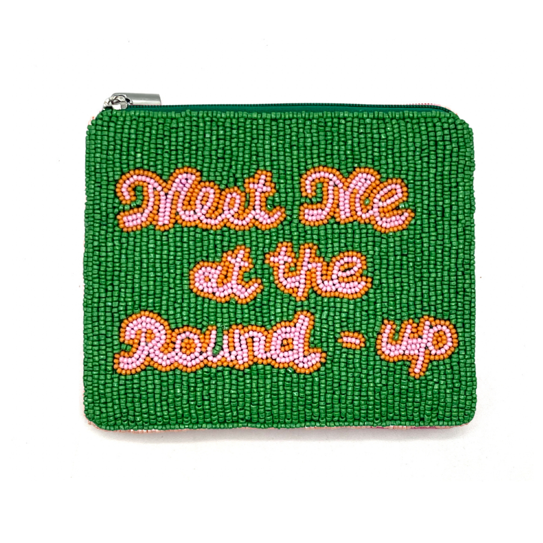 Green beaded pouch with 'Meet Me at the Round-Up' text on a white background
