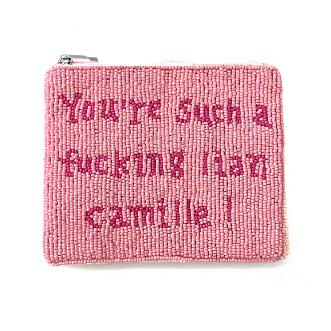 Pink beaded pouch with text on a white background