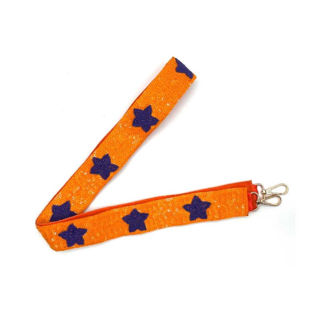 Orange strap with blue star patterns and metal clip on a white background