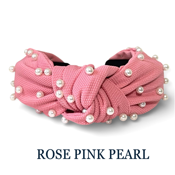 Rose pink headband with pearls on a white background