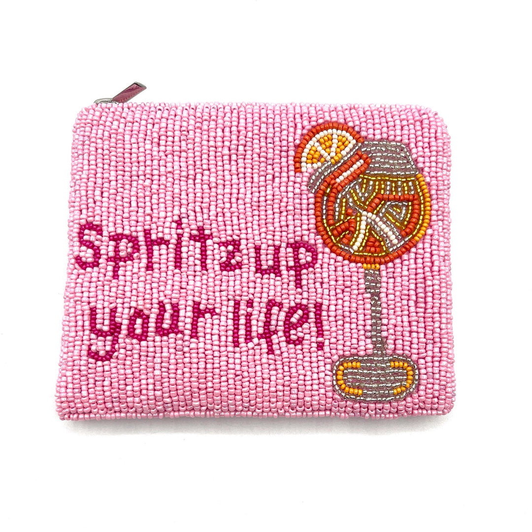 Pink beaded pouch with flamingo design and text on a white background