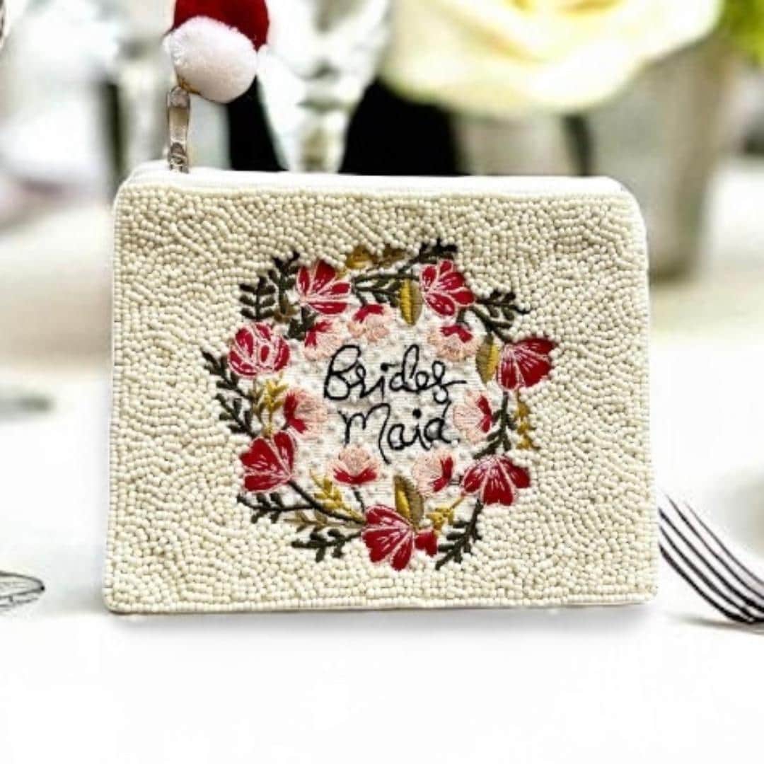 Beaded clutch with floral design and 'Bridesmaid' text on a white background