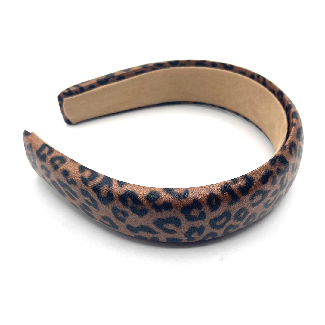 Leopard print headband on a white background