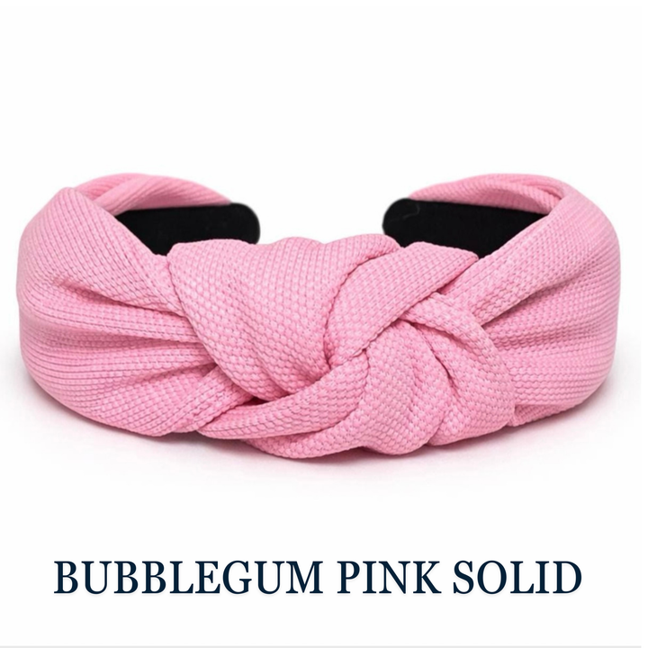 Pink knotted headband on a white background with 'Bubblegum Pink Solid' text.