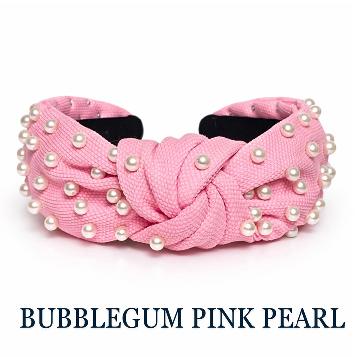 Pink headband with pearls on a white background