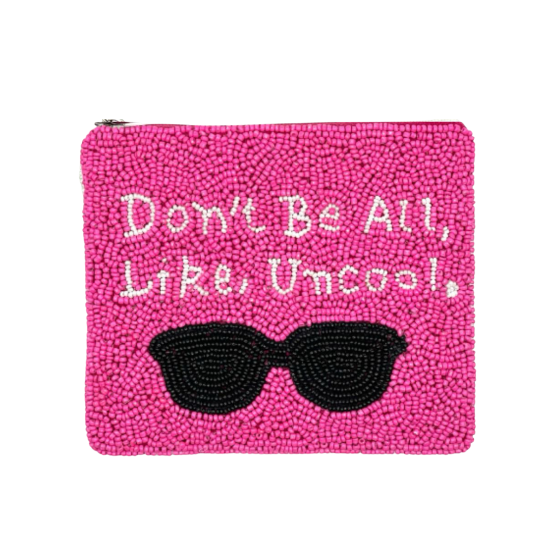 Pink beaded pouch with sunglasses and text on a white background