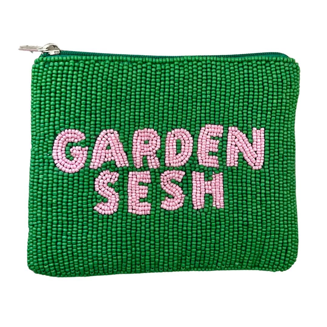 Green beaded pouch with 'Garden Sesh' in pink beads on a white background