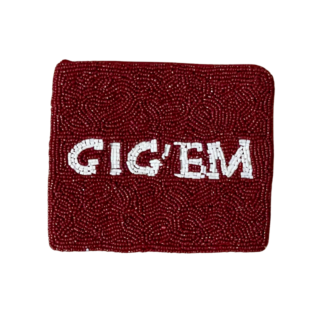 Red beaded wristband with 'GIG'EM' text on a white background