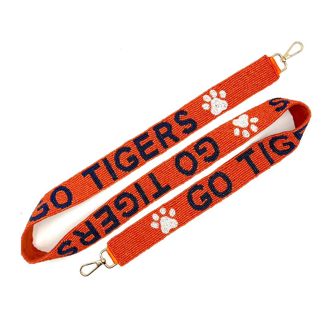 Orange lanyard with 'GO TIGERS' text and paw prints on a white background