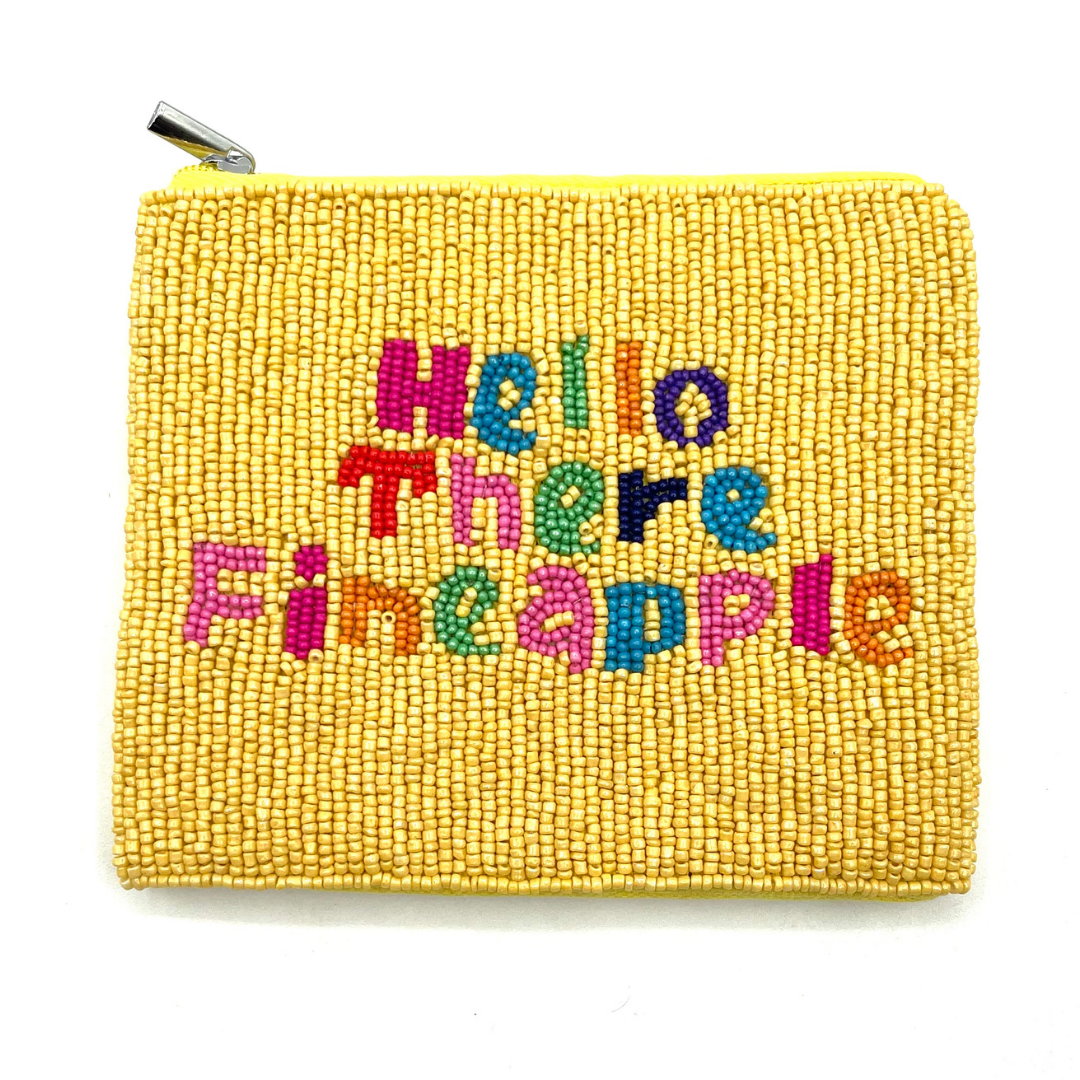 Yellow beaded pouch with colorful text 'Hello There Pineapple' on a white background
