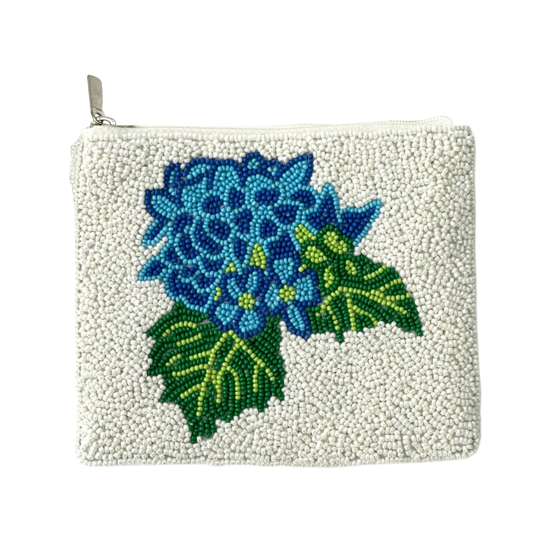 Pouch with blue floral design on a white background