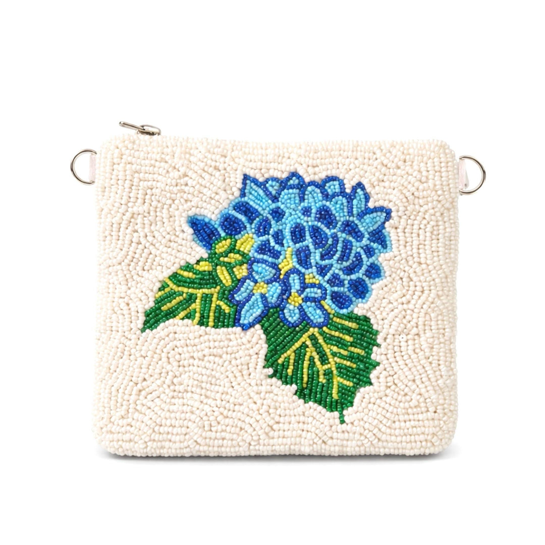 Beaded clutch with blue floral design on a white background