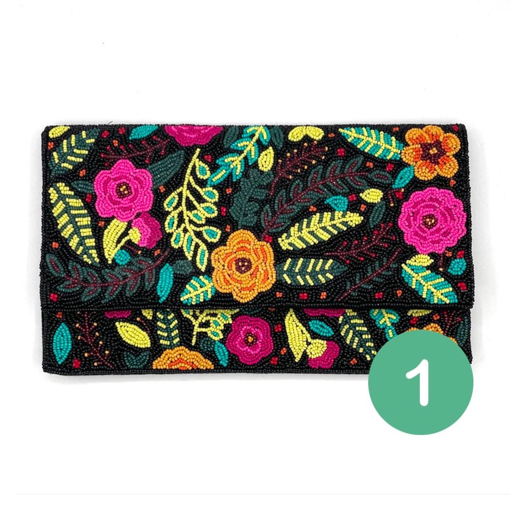 Floral embroidered clutch bag with vibrant colors on a white background