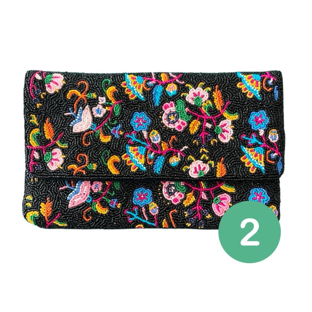 Colorful embroidered clutch bag on a white background