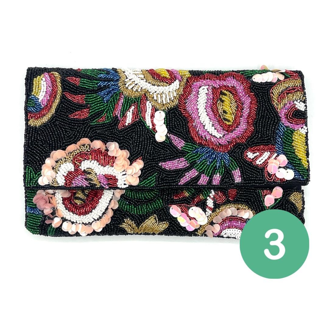 Beaded clutch with floral design on a white background