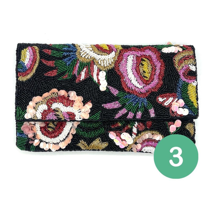 Beaded clutch with floral design on a white background