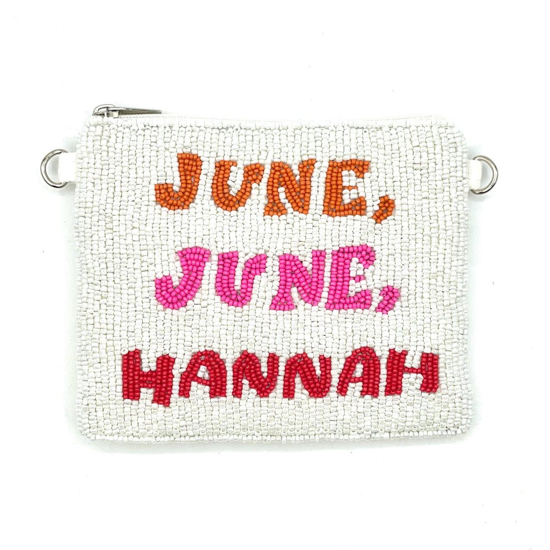 White beaded pouch with 'June, June, Hannah' text in red, pink, and orange on a white background