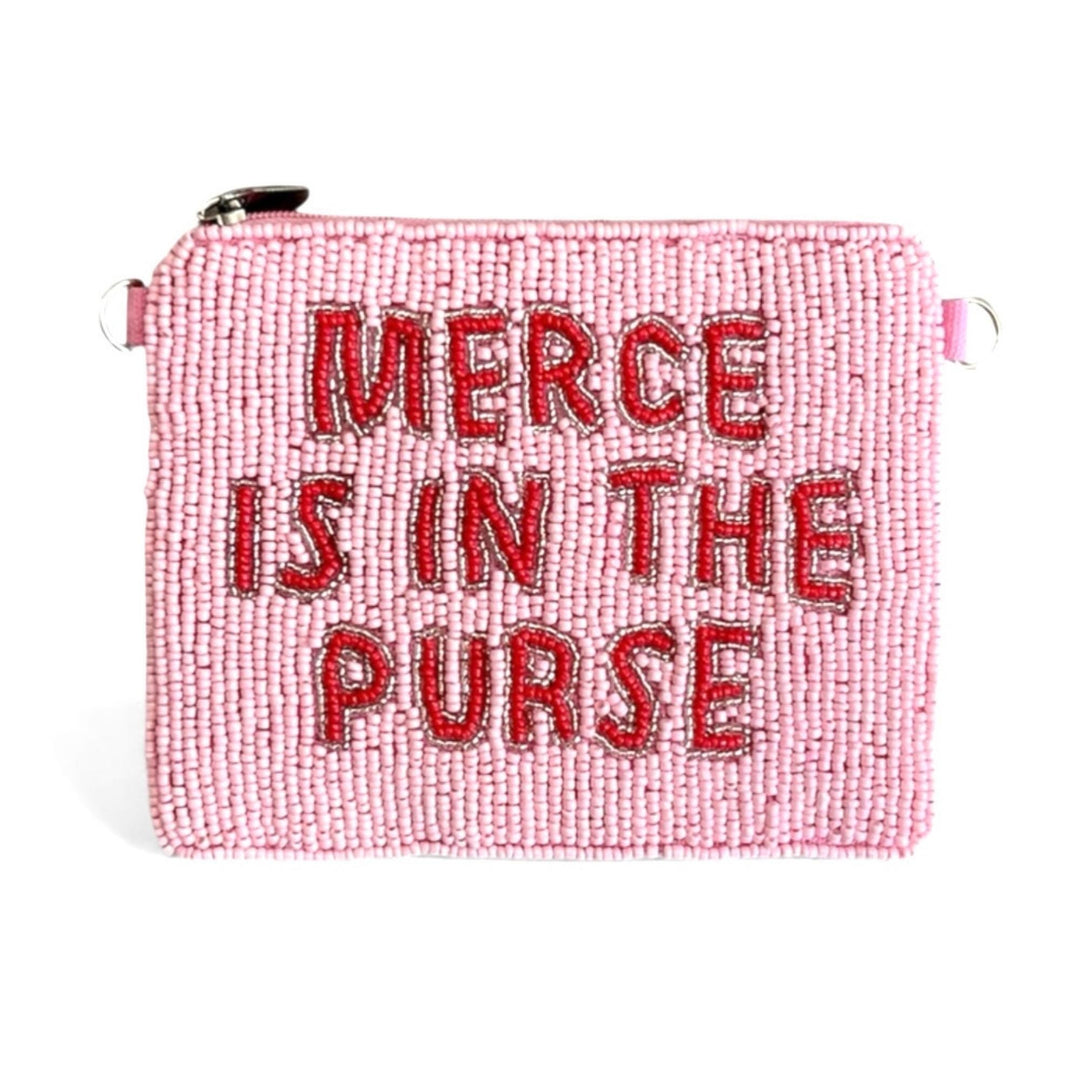 Pink beaded purse with 'Merce is in the purse' text on a white background
