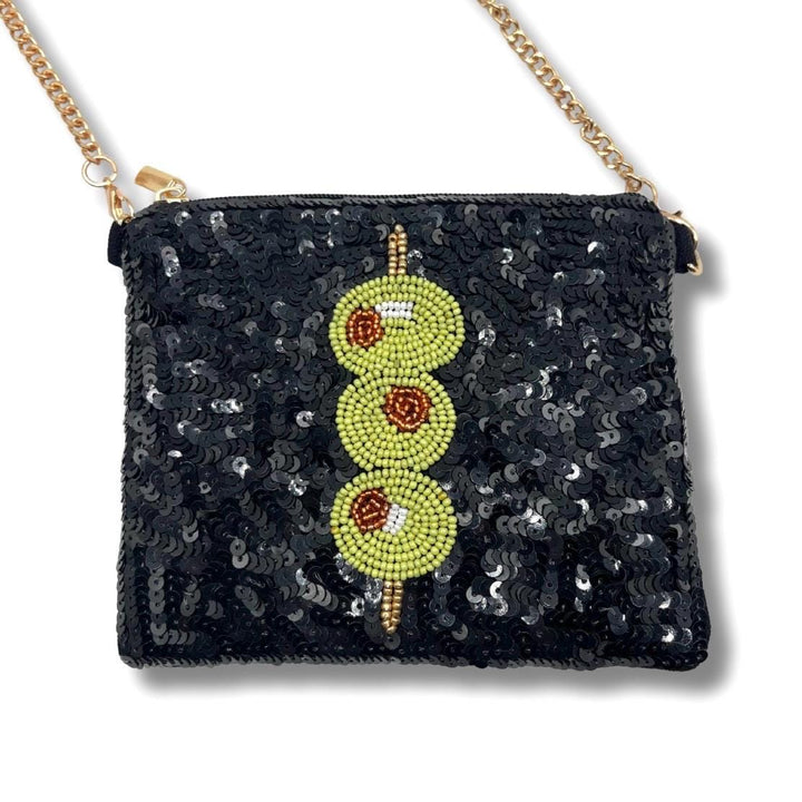 Black sequin clutch with beaded design on a white background