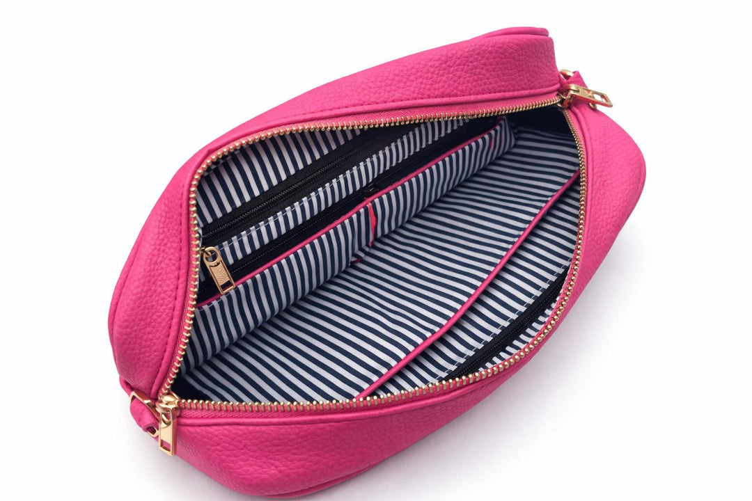 Pink pouch with striped interior on a white background