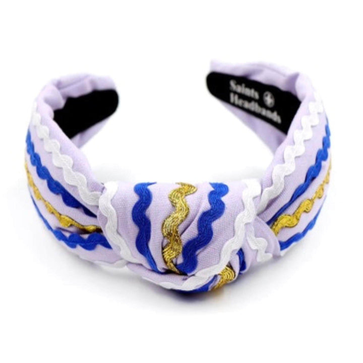 Headband with blue and gold patterns on a white background