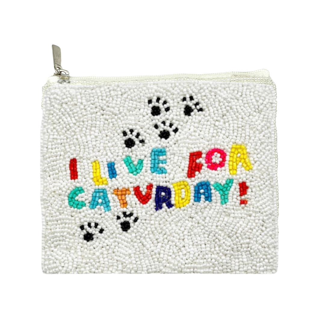 White beaded pouch with colorful text 'I LIVE FOR CATVARDAY!' and paw prints on a white background