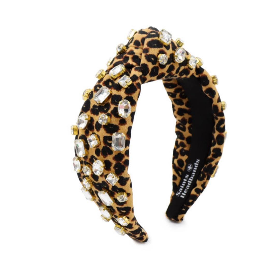 Leopard print headband with rhinestones on a white background