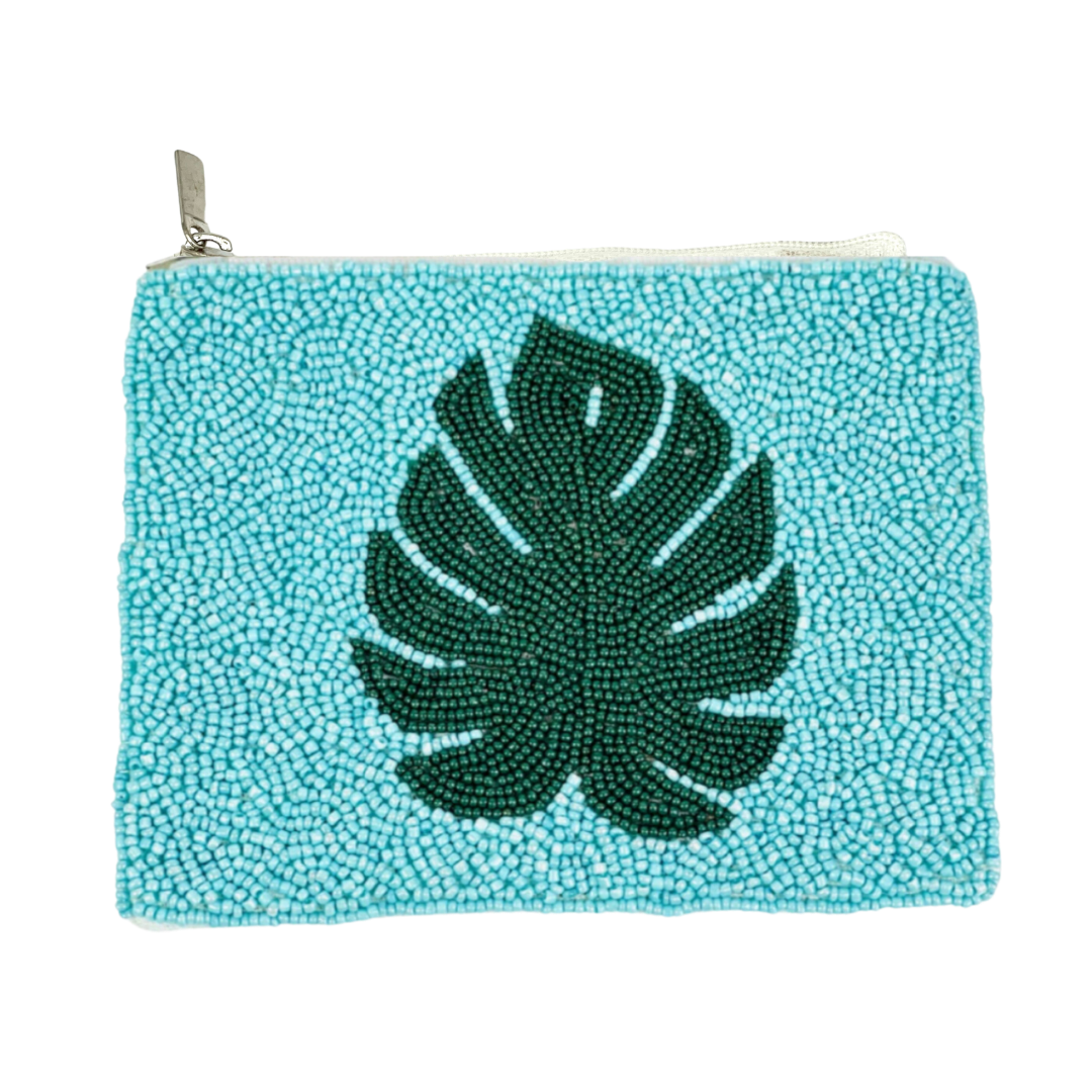 Turquoise beaded pouch with a green leaf design on a white background