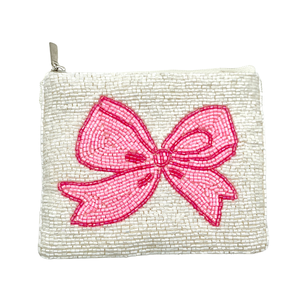 Small pouch with a pink beaded bow on a white background