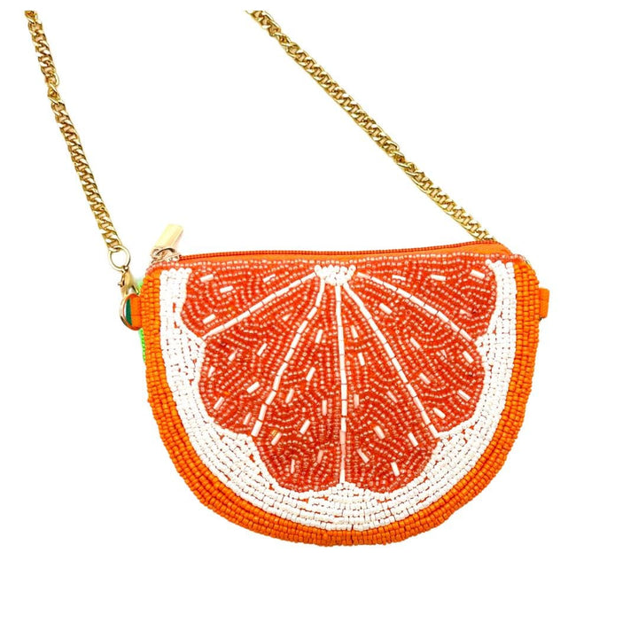 Beaded fruit-shaped handbag resembling an orange slice on a white background