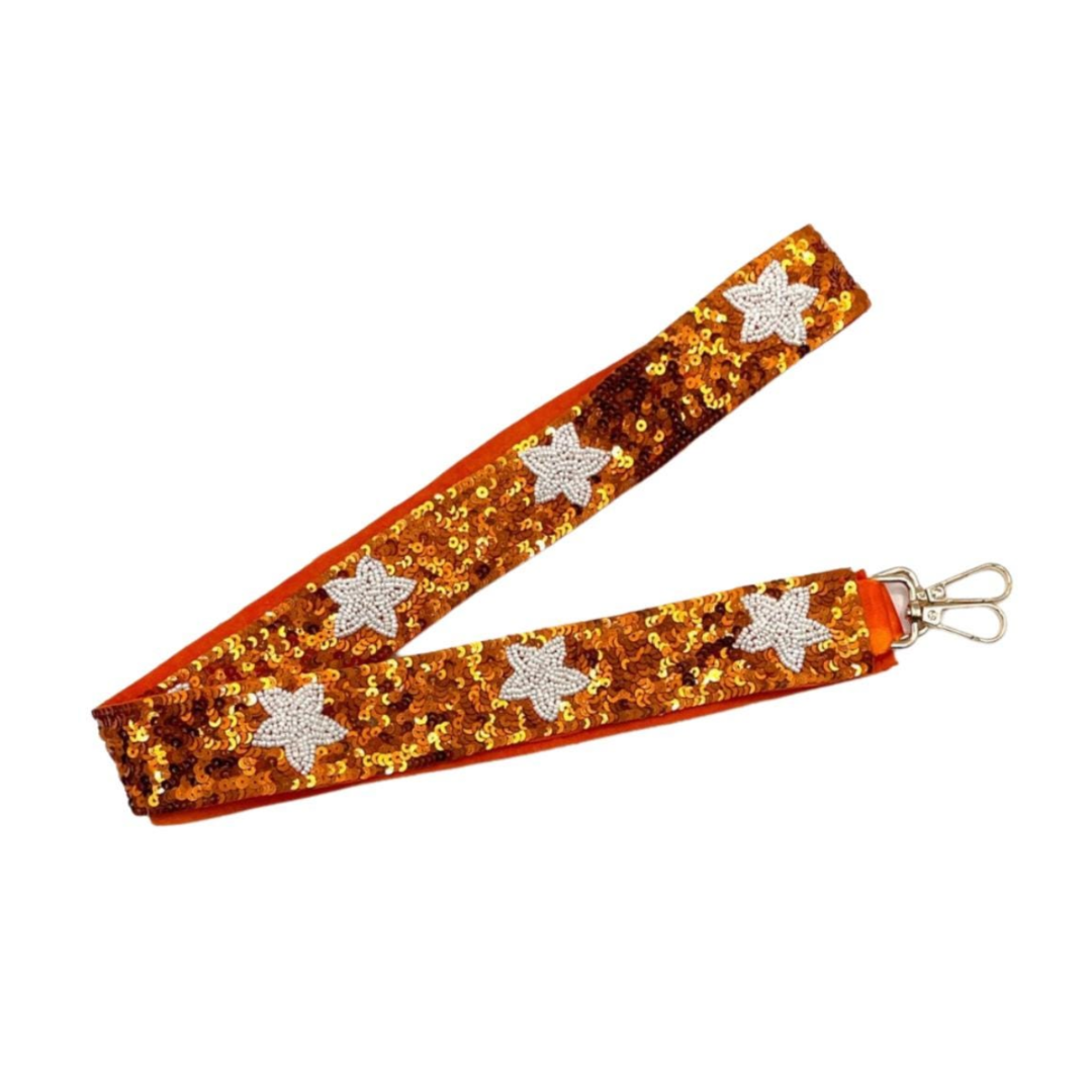 Orange sequin lanyard with star designs on a white background