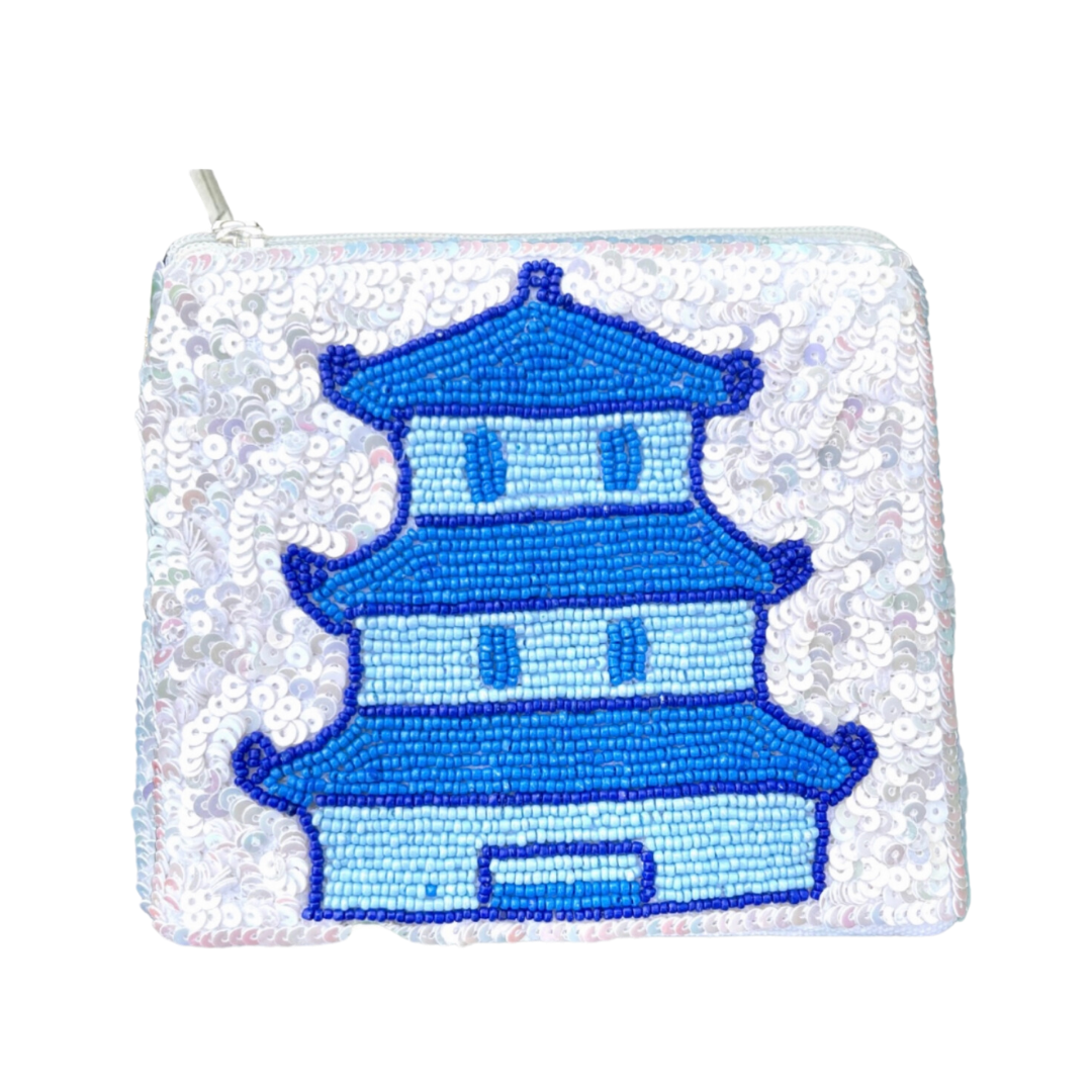 Sequined pouch with a blue pagoda design on a white background