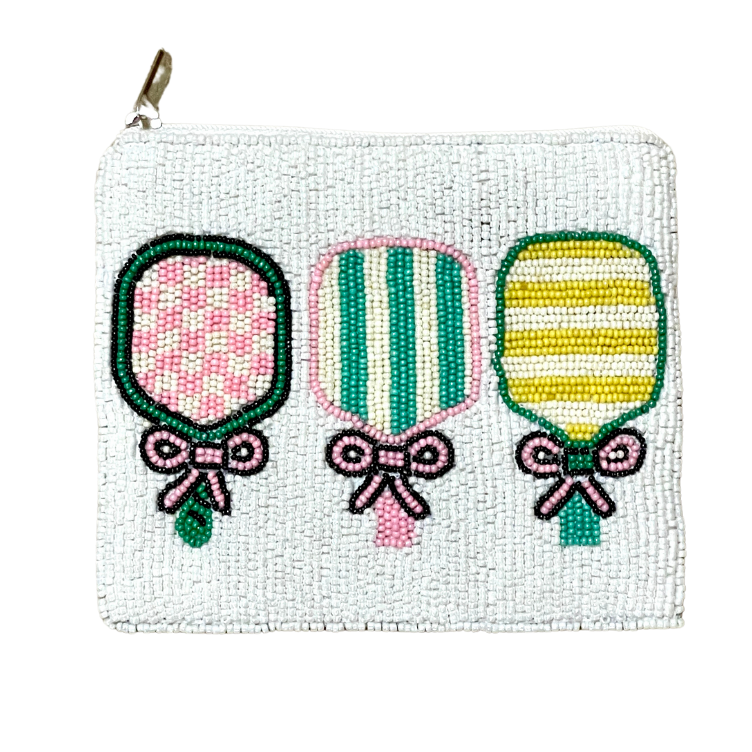 White beaded pouch with embroidered balloons and bows on a white background