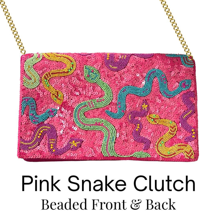 Pink snake clutch with beaded design on a white background
