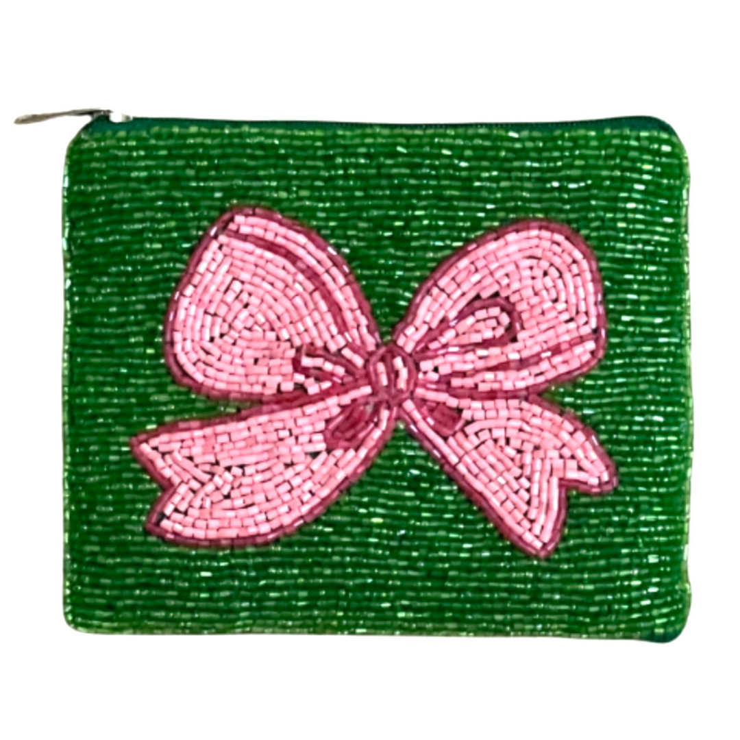 Green beaded pouch with a pink bow on a white background