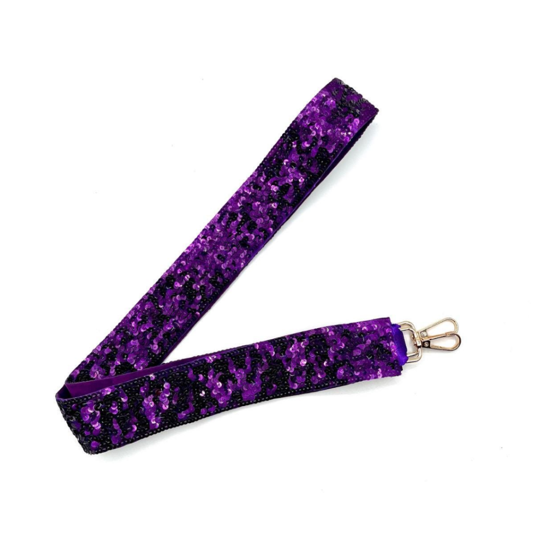 Purple glittery lanyard with a metal clip on a white background