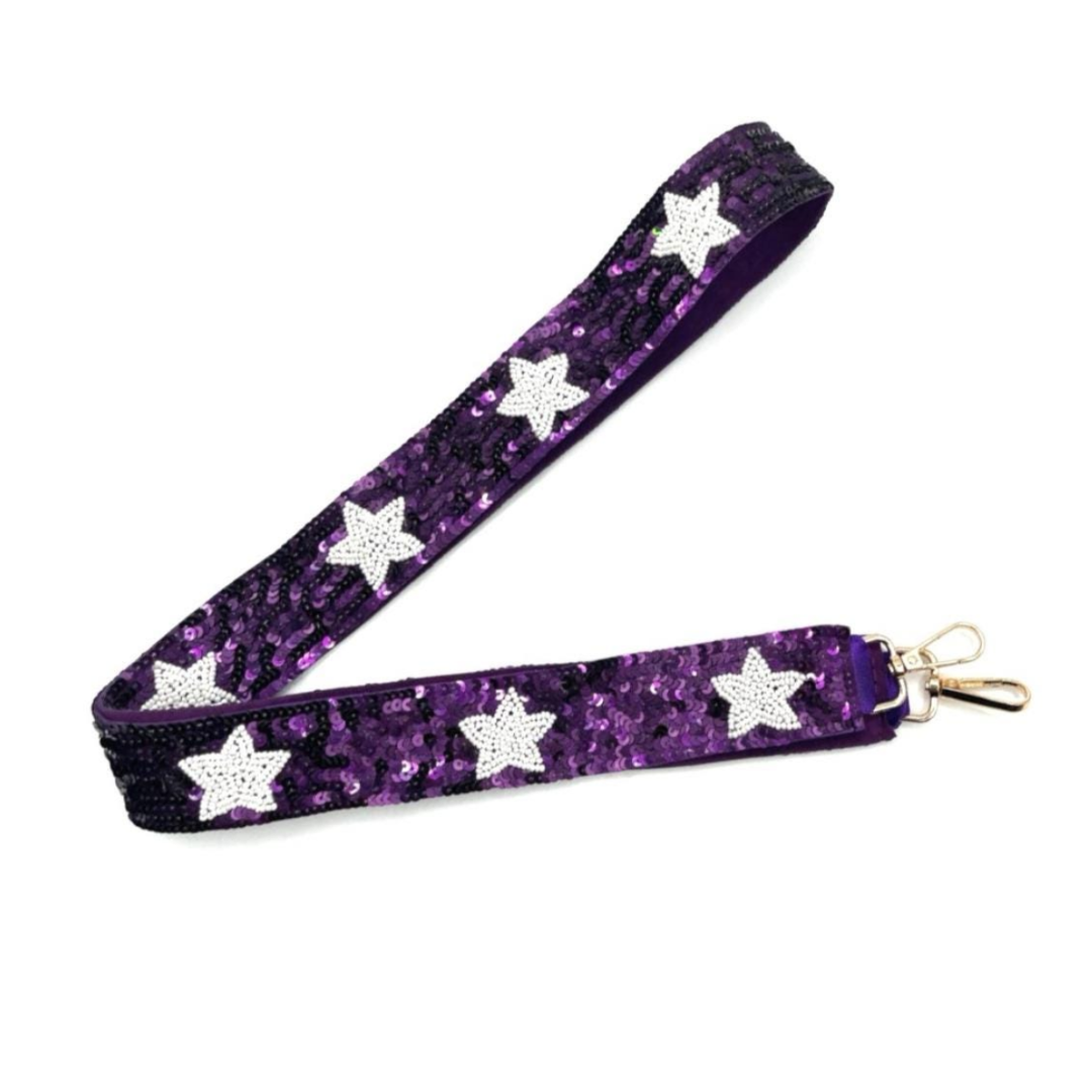 Purple glittery strap with silver star patterns and a gold clasp on a white background