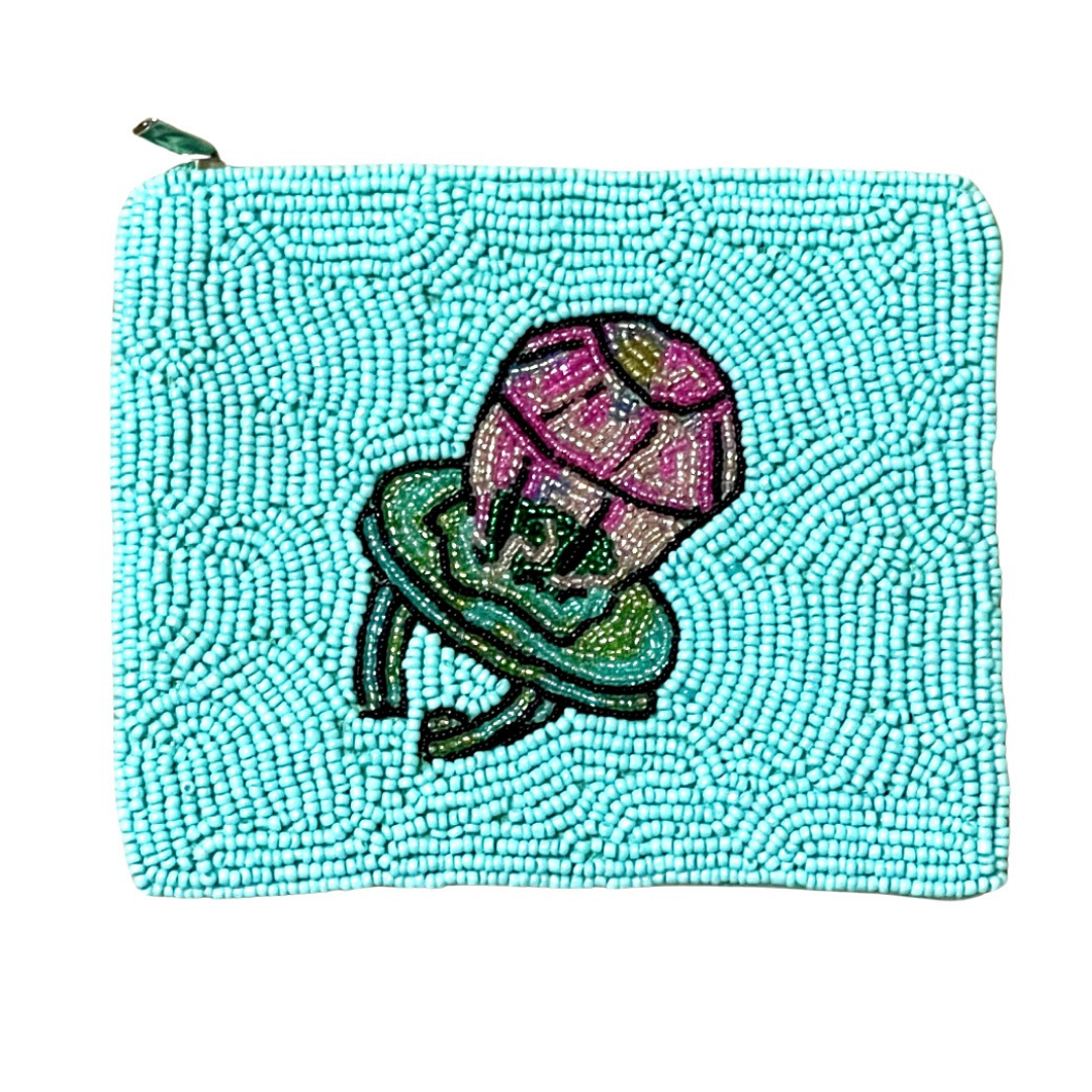 Turquoise beaded pouch with a pink and green embroidered design on a white background