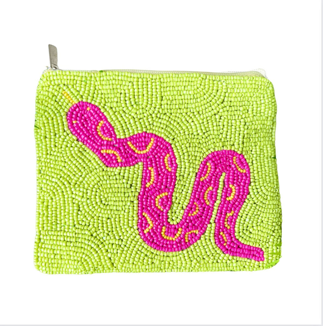 A small, green beaded coin purse with a depiction of a snake in the center, featuring pink and yellow accents.