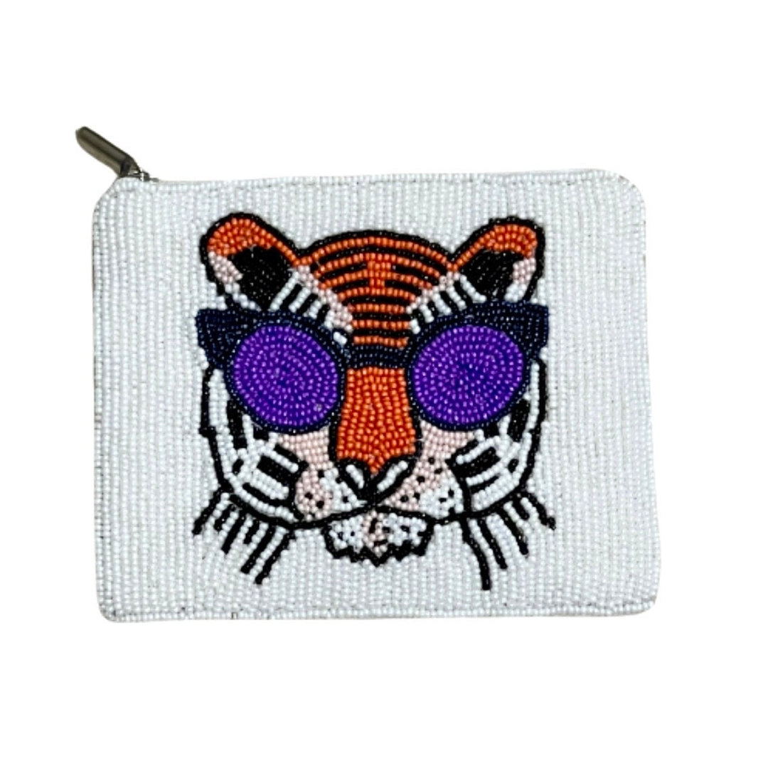 A beaded coin purse featuring a tiger design with sunglasses, hand-sewn seed beads, and a zipper closure.