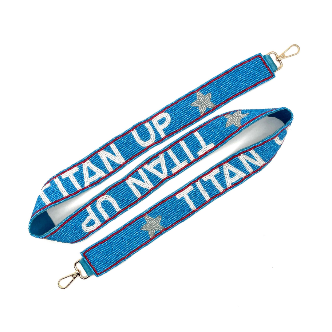 Blue strap with 'LIFT UP TITAN' text and star designs on a white background