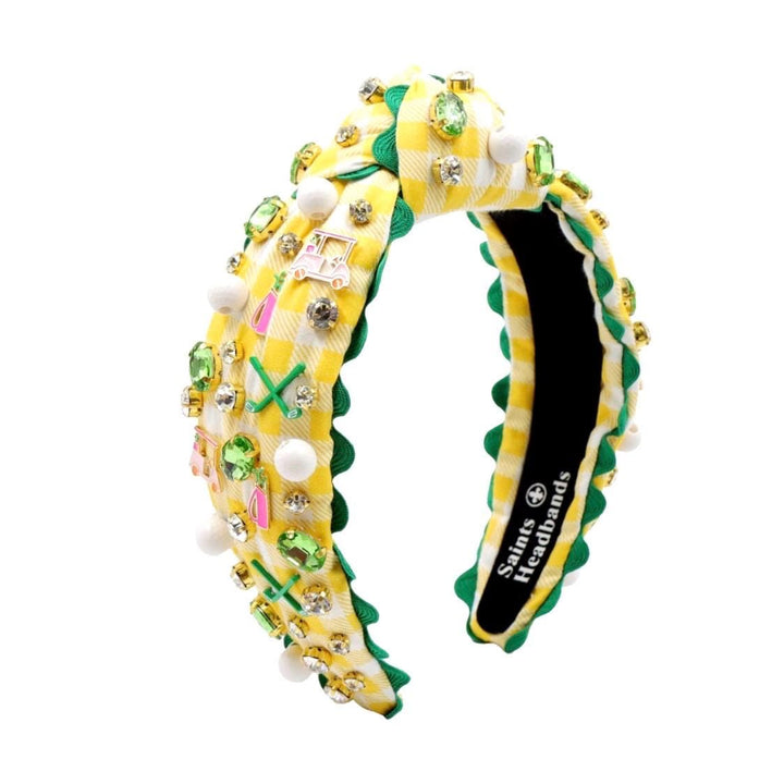 Decorative headband with yellow and green pattern on a white background