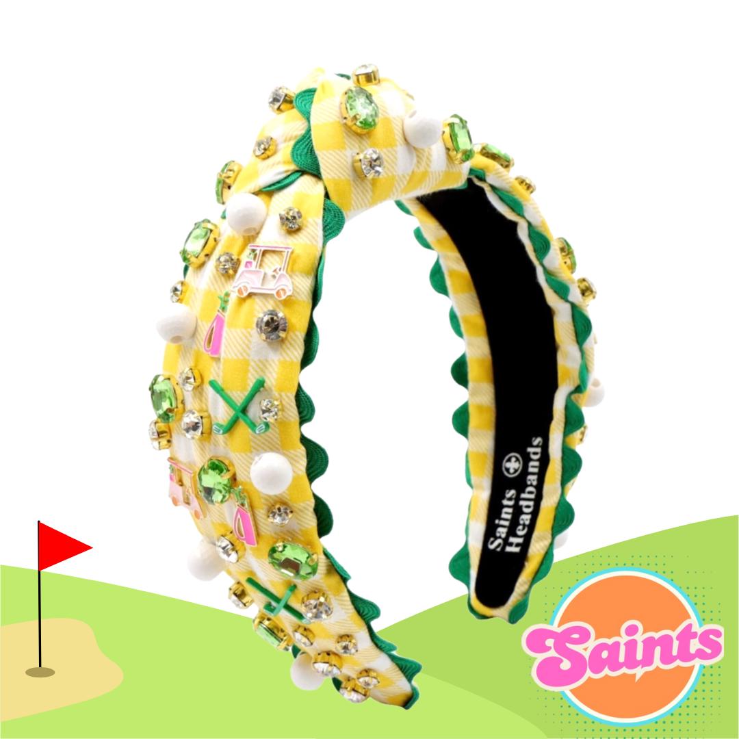 Decorative headband with golf-themed design on a white background