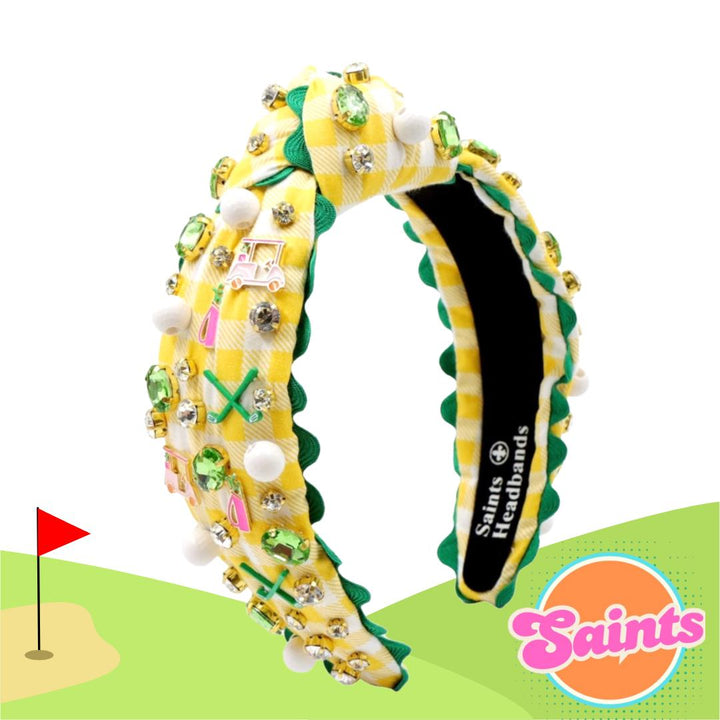 Decorative headband with golf-themed design on a white background