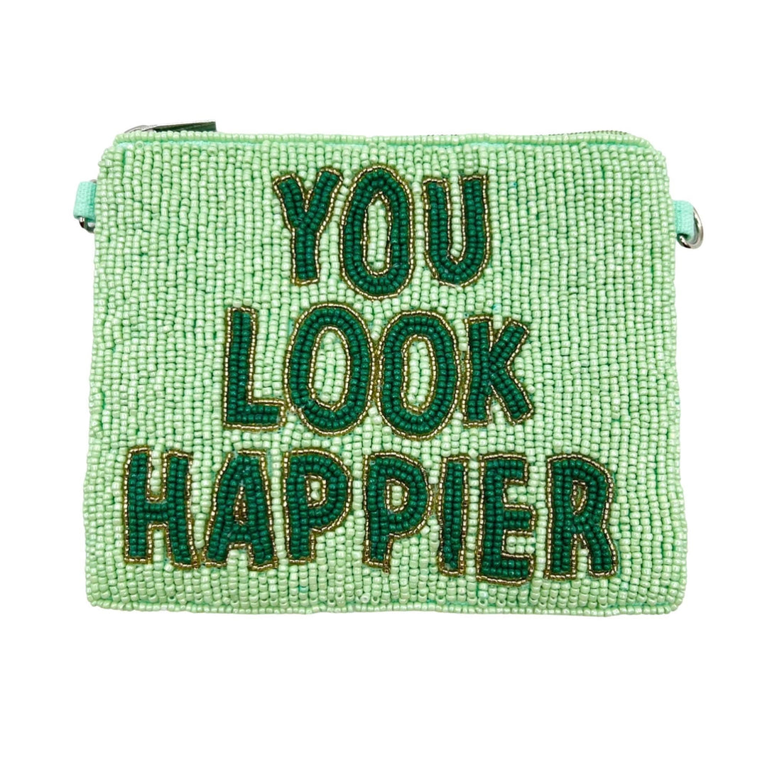 Green beaded pouch with 'YOU LOOK HAPPIER' text on a white background